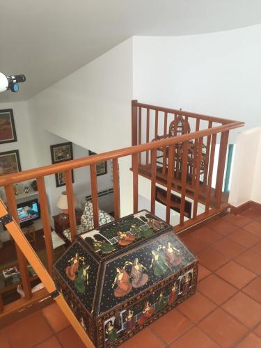 a suitcase sitting on the floor next to a staircase at Villa independiente con acceso a la playa in Son Xoriguer