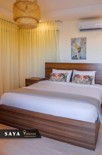 a bedroom with a large bed in a room at Villa Saya Jerash in Jerash