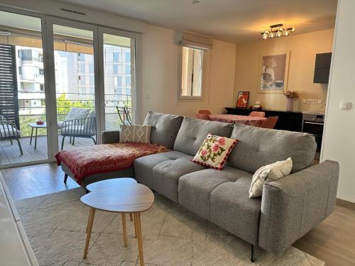 T3 2 chambres avec balcon et place de stationnement
