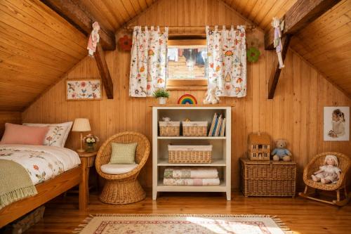 a bedroom with a bed and a book shelf at Tourist Farm Ranč Velka in Spodnja Velka