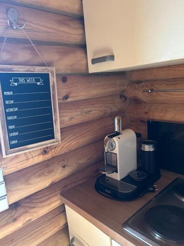 a kitchen with a coffee maker on a counter at Vacations for a good cause in Drochtersen