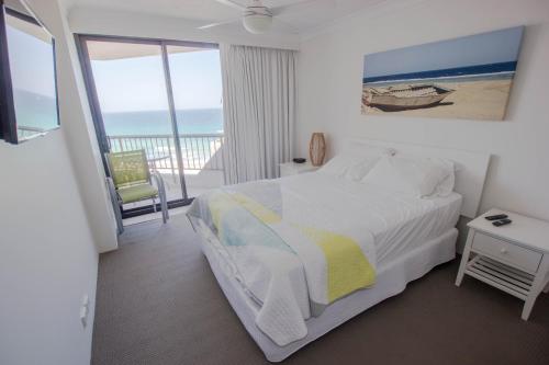 a hotel room with a bed and a window at Carrington Court in Gold Coast