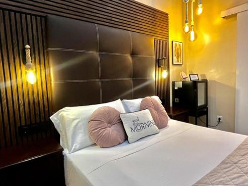 a bedroom with a bed with two pillows on it at Front Arc in Barcelona