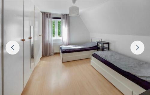two images of a bedroom with two beds and a door at Grå villa in Vislanda
