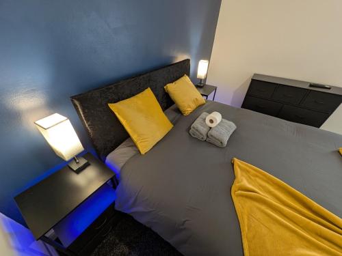 a bedroom with a large bed with a towel on it at Stay Sleep Rest - Cranbrook in Doncaster