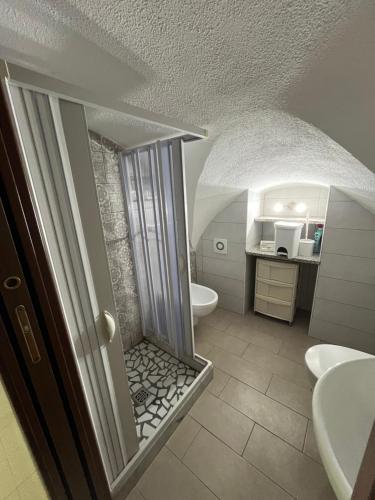 a bathroom with a toilet and a sink at Antica Casa Cavaliere in Tramonti