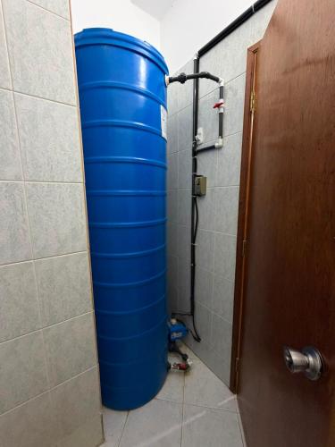a blue barrel in a bathroom with a shower at Isla de margarita in Pampatar