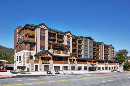 a large building on the side of a street at Courtyard by Marriott Lake George in Lake George
