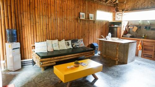 a living room with a couch and a table at Happiness Native Villa in El Nido