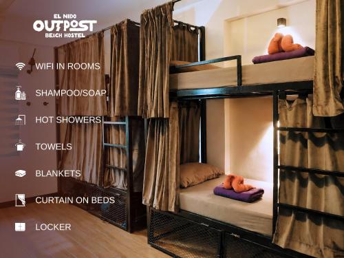 a group of bunk beds in a room at Outpost Beach Hostel in El Nido
