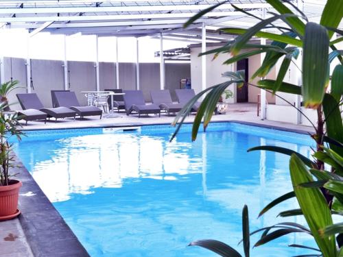 Bazén v ubytování Grand Elite Hotel Pekanbaru nebo v jeho okolí