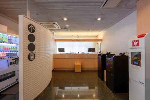 a gas station with a waiting room with machines at HOTEL MYSTAYS Higashi Ikebukuro in Tokyo