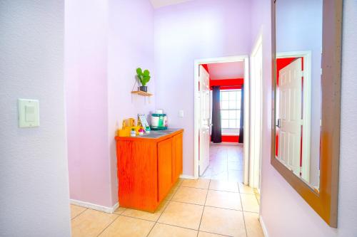 a hallway with a wooden dresser in a room at Private Guestrooms OR Entire Home Rental in North Las Vegas in Las Vegas