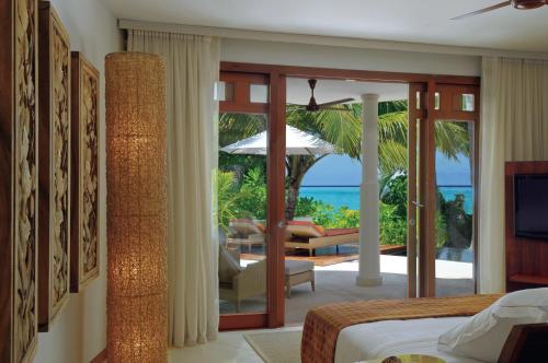 a hotel room with a view of the ocean at Constance Halaveli in Hangnaameedhoo