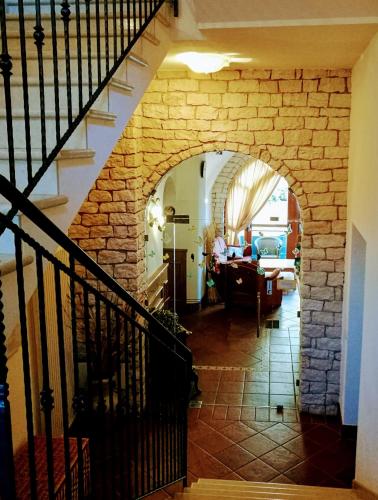 an archway in a house with a living room at Agritur La Pieve in Taio
