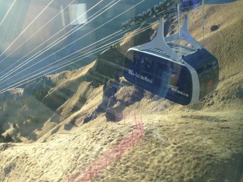 a ski lift going up a sand hill at Hotel Villa Rosella Park & Wellness in Canazei