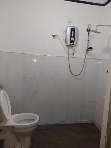 a bathroom with a toilet and a shower at Duleni villa in Haldummulla