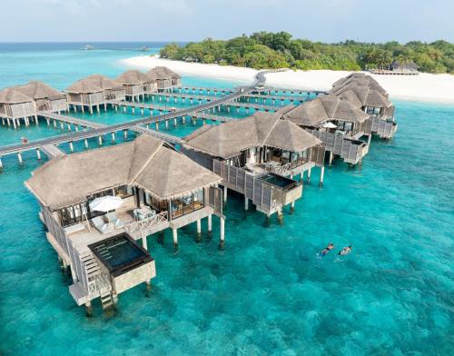 an aerial view of a resort in the water at JA Manafaru, The Real Maldives - Complimentary Seaplane for 7 nights and more - Stay Period 01 May 2026 to 23 Dec 2026 in Hoarafushi