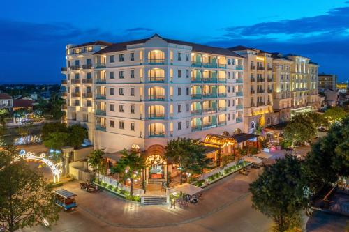 an overhead view of a building in a city at night at Little Residence - A Boutique Hotel & Spa in Hoi An