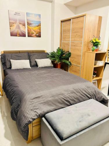 a bedroom with a large bed in a room at The Tranquil Nook in Mandaue City