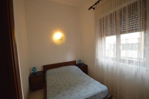 En eller flere senger på et rom på Riva Mare Apartment