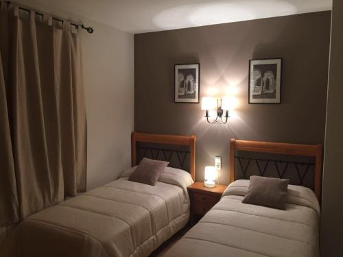 Postel nebo postele na pokoji v ubytování Apartamentos Residencial Fornocal