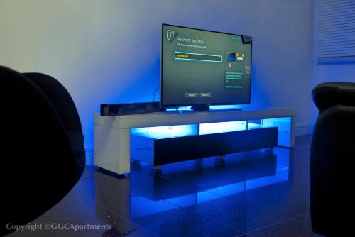 a flat screen tv sitting on top of a table at GGC Luxury Serviced Apartment - Platinum in Lagos