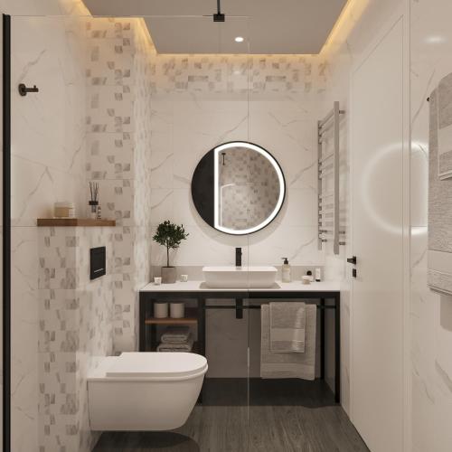 a bathroom with a sink and a toilet and a mirror at Tailormade Hotel Median Niš in Niš