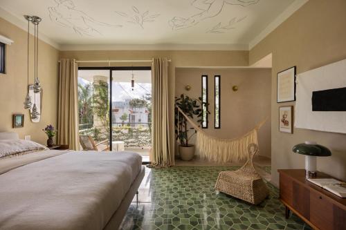 a bedroom with a bed and a large window at CASA FRIDA by DW in San Juan