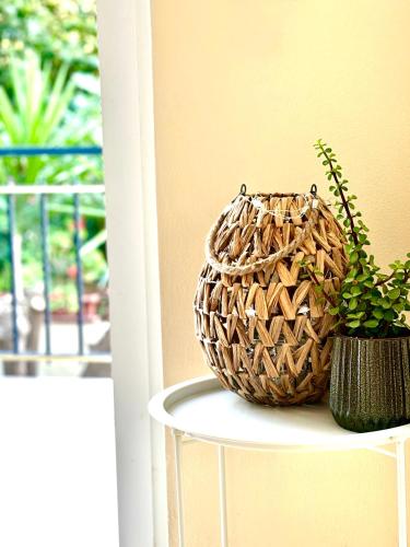 a wicker basket sitting on a table next to a plant at Fuji Hotel in Edipsos