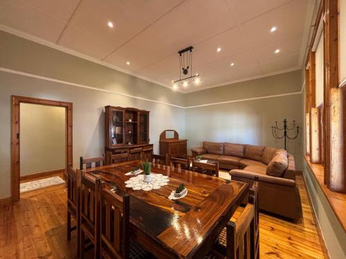 a living room with a table and a couch at River and Ridge in Cradock