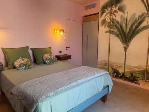 a bedroom with a bed and a palm tree mural at Alpa Nera in Galeria