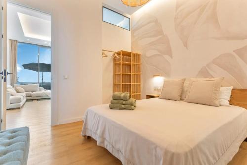 a bedroom with a large bed in a room at MAAR Suites Cotillo in El Cotillo