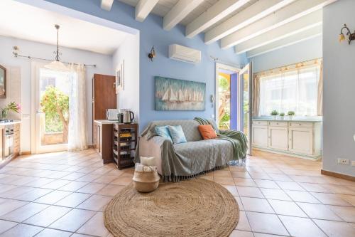 a living room with a couch and a table at Alloggio Poseidone in Villasimius