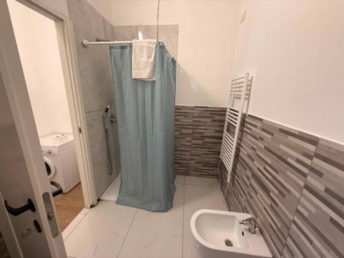 a bathroom with a shower and a sink at CR BnB Rozzano 2 in Rozzano