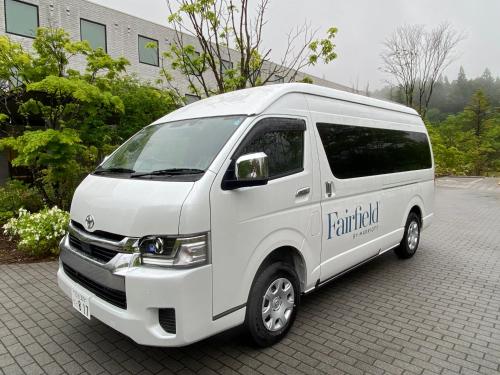 a white van parked in a parking lot at Fairfield by Marriott Tochigi Nikko in Nikko