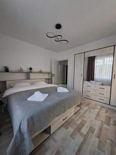 a bedroom with a bed and a ceiling fan at Studio Niki in Smolyan