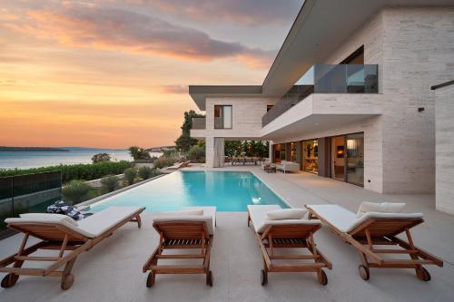 Beachfront Villa Malia near Trogir with Heated Pool & Jacuzzi
