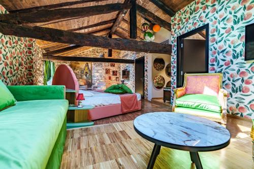a room with two beds and a table at Aurum Collection - Como Suites in Como