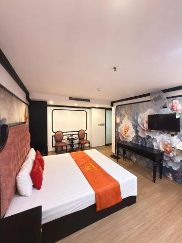 a hotel room with a bed and a piano at My House Hotel Hanoi in Hanoi