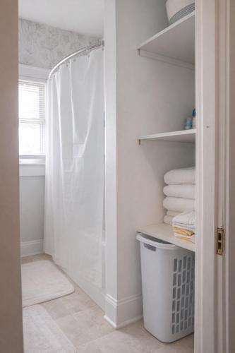 a bathroom with a shower and some towels at Tranquility Corner in Ashland