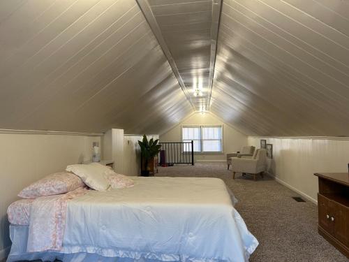 a bedroom with a large bed in a attic at Tranquility Corner in Ashland