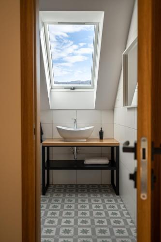 a bathroom with a sink and a window at Widokówka in Wetlina