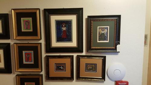 a group of framed pictures on a wall at Parseierblick in Sankt Anton am Arlberg