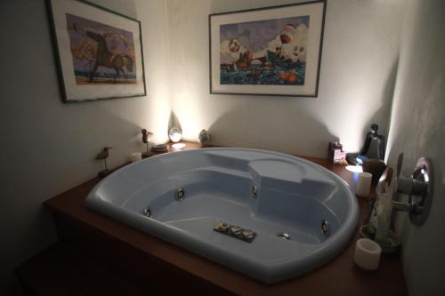 a bathroom with a large tub in a room at Casa D'ambra in Vernazza