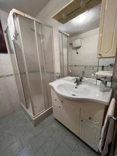 a bathroom with a sink and a shower at Casa Giordano in Tramonti