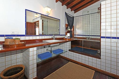 a bathroom with a sink and a mirror at Casa Simbad in Pájara