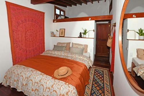 a bedroom with a bed with a hat on it at Casa Simbad in Pájara