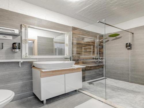 a bathroom with a sink and a shower at Silver Gate Rooms-Diocletian's Palace in Split