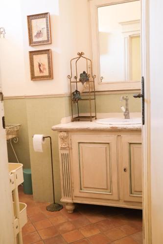 a bathroom with a sink and a mirror at Mare di Gioia in Viareggio